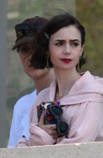 LILY COLLIN Shoots a Romantic Scene with Eugenio Franceschini on the Set of Emily in Paris 05/19/2025