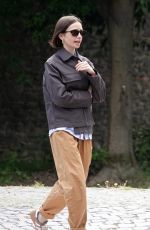LILY COLLINS and Charlie McDowell Out with Their Dog at Villa Borghese Park in Rome 05/10/2025