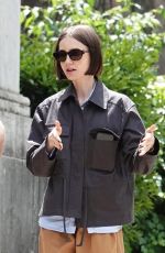 LILY COLLINS and Charlie McDowell Out with Their Dog at Villa Borghese Park in Rome 05/10/2025