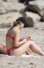 MADLYN CLINE ina Red Bikini at a Beach in Sitges in Spain 05/04/2025