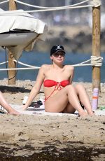 MADLYN CLINE ina Red Bikini at a Beach in Sitges in Spain 05/04/2025