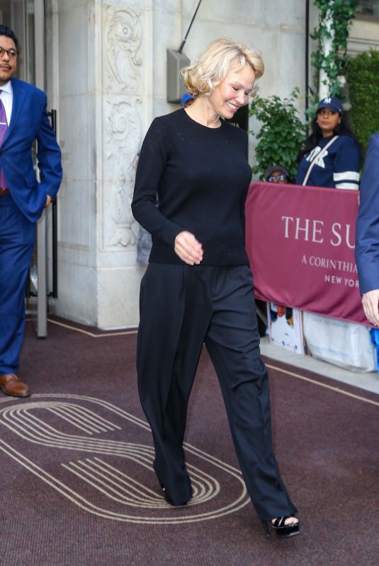 PAMELA ANDERSON Leaves Her Hotel in New York City 05/19/2025