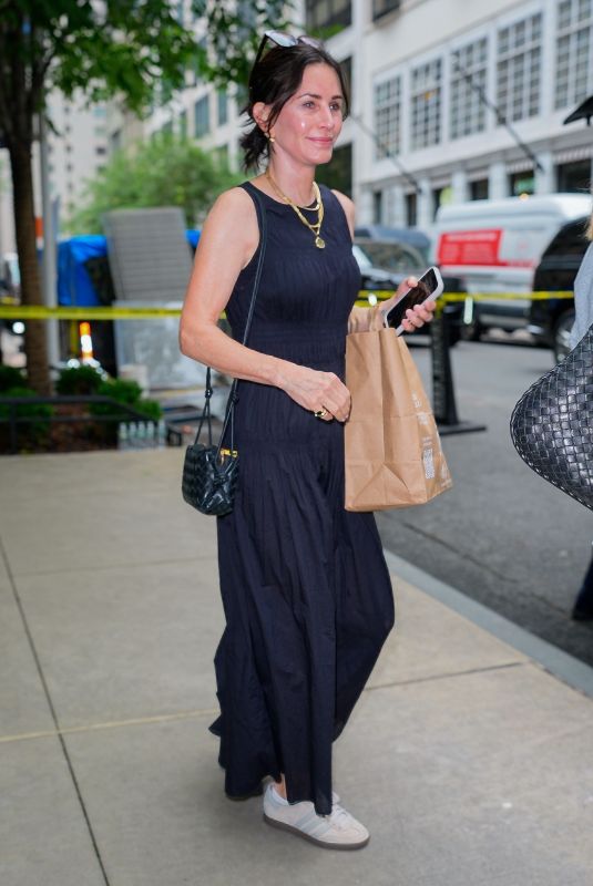 COURTENEY COX Leaves Her Hotel in New York City 06/27/2025