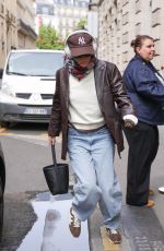 EMMA WATSON Out in a Brown Leather Jacket and Jeans in Paris 06/08/2025
