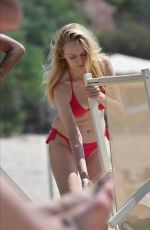 HEATHER GRAHAM in a Red Bikini at a Beach in Sardinia 06/20/2025