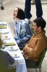 LILY COLLINS Filming a Lunch Scene for Emily in Paris in- Rome 05/08/2025
