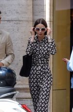 LILY COLLINS Filming a Scene Outside Fendi Store for Emily in Paris in Rome 05/08/2025