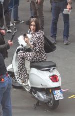 LILY COLLINS Filming a Scene Outside Fendi Store for Emily in Paris in Rome 05/08/2025