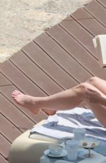 OLIVIA WILDE in Bikini at a Beach in Taormina 06/14/2025
