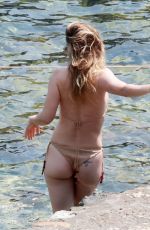 OLIVIA WILDE in Bikini at a Beach in Taormina 06/14/2025