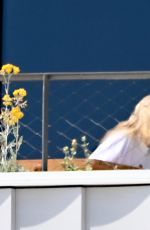 SABRINA CARPENTER on Her Hotel Balcony in Barcelona 06/07/2025