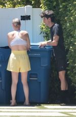 TEDDI MELLENCAMP Bringing in Trash Bins at Her Home in Encino 06/16/2025