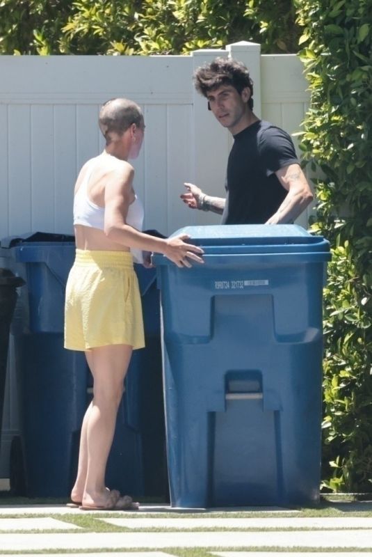 TEDDI MELLENCAMP Bringing in Trash Bins at Her Home in Encino 06/16/2025
