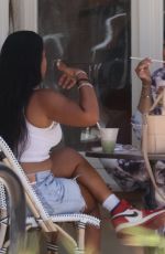 TIA MOWRY Enjoys Smoothie with a Friend in Los Angeles 06/18/2025