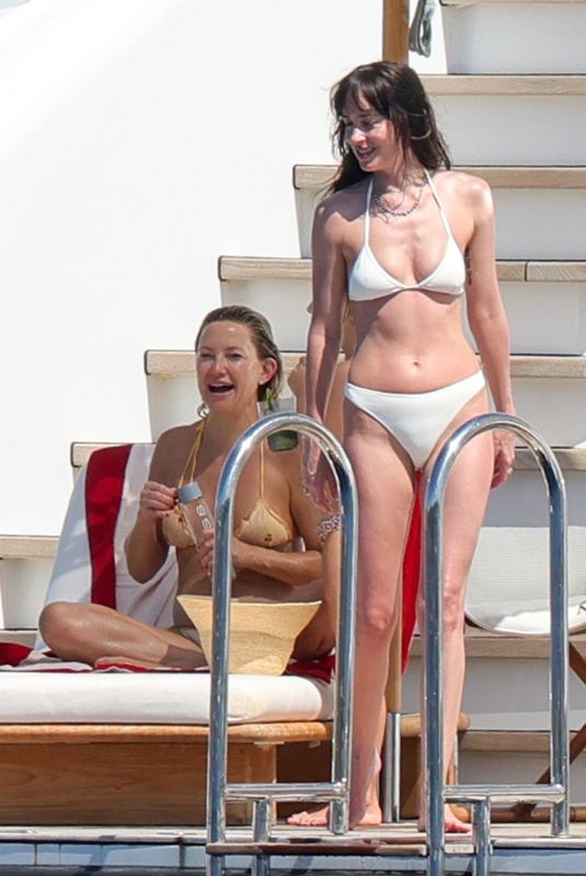 DAKOTA JOHNSON and KATE HUDSON in Bikinis at a Yach in Ibiza 07/02/2025