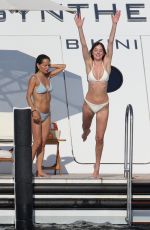 DAKOTA JOHNSON and KATE HUDSON in Bikinis at a Yach in Ibiza 07/02/2025