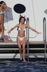 DAKOTA JOHNSON and KATE HUDSON in Bikinis at a Yach in Ibiza 07/02/2025