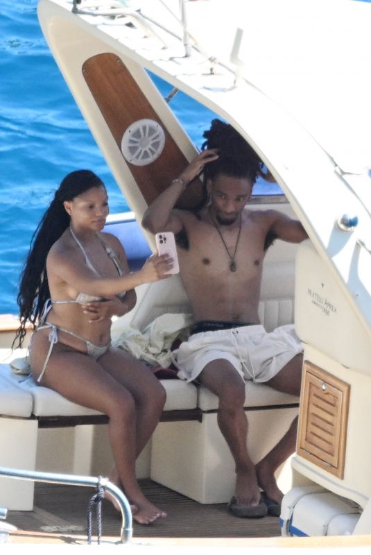 HALLE BAILEY in Bikini at Boat Day with Scott Bridgeway in Positano 06/28/2025
