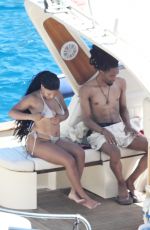 HALLE BAILEY in Bikini at Boat Day with Scott Bridgeway in Positano 06/28/2025