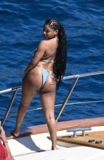 HALLE BAILEY in Bikini at Boat Day with Scott Bridgeway in Positano 06/28/2025