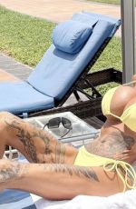 KATIE PRICE in a Yellow Bikini on Holiday in Dubai 07/04/2025