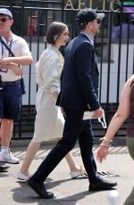 LILY COLLINS Arrives at Mens