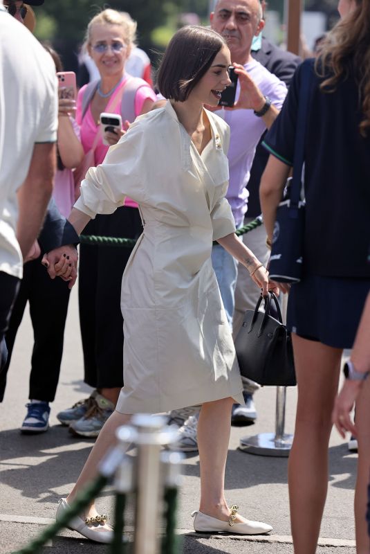 LILY COLLINS Arrives at Mens