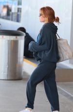 ISLA FISHER Arrives at LAX Airport in Los Angeles 08/03/2025