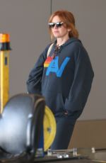 ISLA FISHER Arrives at LAX Airport in Los Angeles 08/03/2025