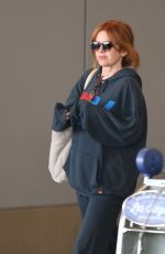 ISLA FISHER Arrives at LAX Airport in Los Angeles 08/03/2025