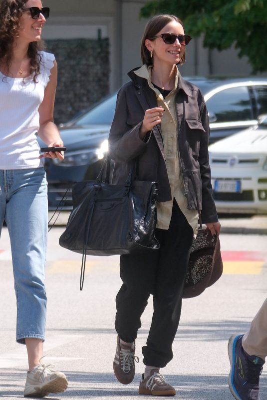 LILY COLLINS Arrives in Venice Ahead of Filming for Emily in Paris 08/14/2025