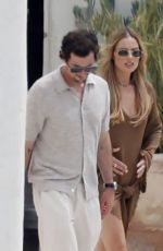 MARGOT ROBBIE Leaves a Restaurant with Friends in Ibiza 07/08/2025