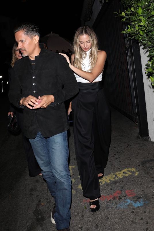 MARGOT ROBBIE Leaves Cara Delevingne