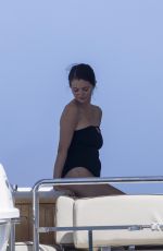 SELENA GOMEZ in a Black Swimsuit on a Luxury Yacht in Cabo San Lucas 08/24/2025