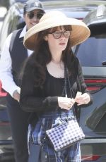 ZOOEY DESCHANEL Arrives at Jennifer Klein