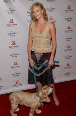 CHARLIZE THERON at Lint Roller Party in Los Angeles 04/28/2004