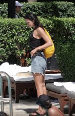 DUA LIPA in Cut-off Jean Shorts at Her Hotel Pool in Miami 09/27/2025