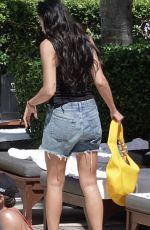 DUA LIPA in Cut-off Jean Shorts at Her Hotel Pool in Miami 09/27/2025