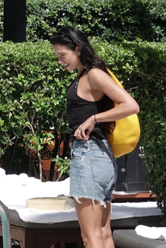 DUA LIPA in Cut-off Jean Shorts at Her Hotel Pool in Miami 09/27/2025