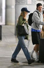 MARGOT ROBBIE and Her Brother Cameron Land at JFK Airport in New York City 09/12/2025