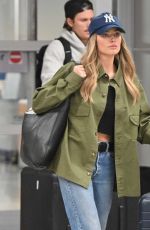MARGOT ROBBIE and Her Brother Cameron Land at JFK Airport in New York City 09/12/2025