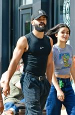 RACHEL ZEGLER and Nathan Louis Fernand Picks up a Jacket at a Charity Shop in London 08/31/2025