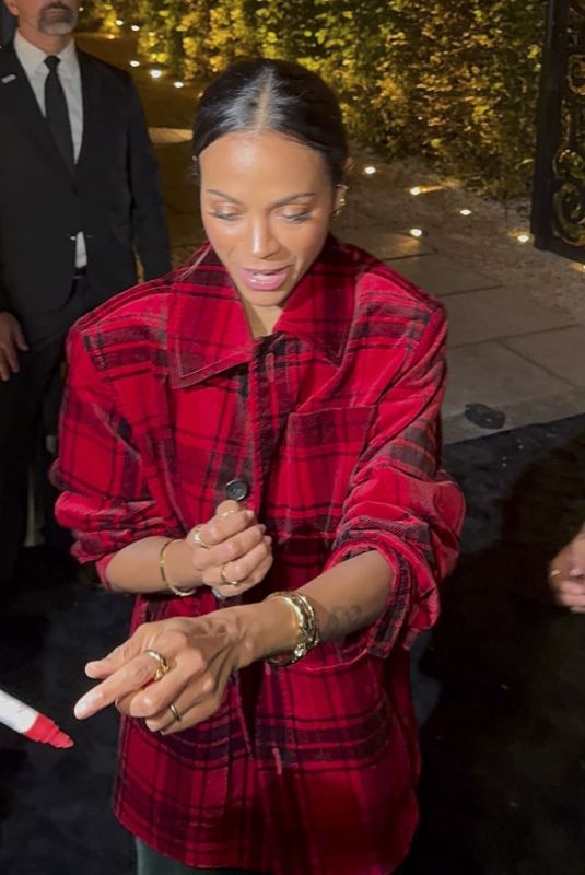 ZOE SALDANA Leaves Grand Opening of RH Paris on Champs-Elysees 09/04/2025