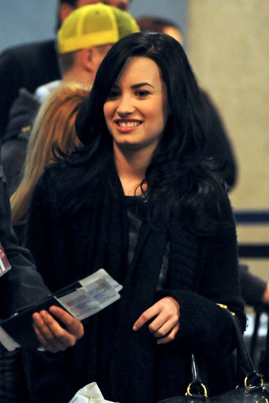 DEMI LOVATO Arrives at LAX Airport 12/18/2009