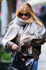 JENNIFER LAWRENCE Still Cuts a Chic Figure on a Rainy Day in New York City 10/13/2025