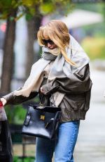 JENNIFER LAWRENCE Still Cuts a Chic Figure on a Rainy Day in New York City 10/13/2025
