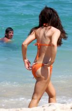 KATE BECKINSALE in an Orange Bikini at a Beach in Mexico 08/17/2008