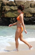 KATE BECKINSALE in an Orange Bikini at a Beach in Mexico 08/17/2008