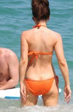 KATE BECKINSALE in an Orange Bikini at a Beach in Mexico 08/17/2008