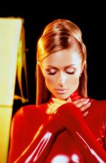 PARIS HILTON in a Tight Red Catsuit Dressed as Britney Spears in Oops I Did It Again 10/27/2025